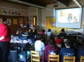 A class from Angoon City School watches a Digital Storytelling presentation