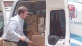 A Connect Arkansas employee delivers a shipment of refurbished computers