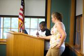 An instructor teaches a local student during a computer basics course