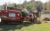 A JKM Consulting crew digs a hole to install fiber for the project’s new network