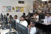 Image: Young visitors to the new Doolittle Community Center use the free interne