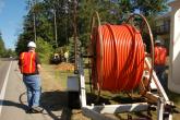 Construction workers lay fiber along Merit’s 2,287 mile fiber optic network