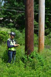 crew member uses GPS device