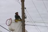 NTUA crews get lifted up to install new fiber lines.