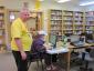 Red Feather Library Director Creed Kidd stands by the main computer use area