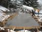 IMG: Crew members pour concrete at DeltaCom’s Blountville/Bristol site