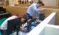 Two workers set up the new laptops and broadband access for Teen’Scape.