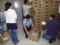 Volunteers unpack new computers