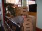 A library staff member hugs a shipment of new Dell computers