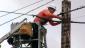 Worker stringing fiber optic cable for the NoaNet project.