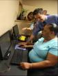 Two FIGHT computer instructors lead participants