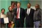 IMG: Mayor Christopher B. Coleman and project members celebrate at an Open House