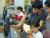 Lincoln Heights instructor Mario Martinez provides assistance to a young student