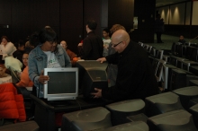 Img: Graduates at Lorain County Community College pick up their refurbished PCs