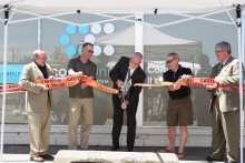 Officials cut a ribbon at the Pend Oreille’s construction ceremony