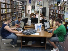 A group of visitors use the Smithville Public Library computers