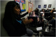 IMG: An apprentice leads a training class at one of the public computer centers