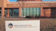 BroadbandUSA sign outside Red Mountain Elementary School in Utah.
